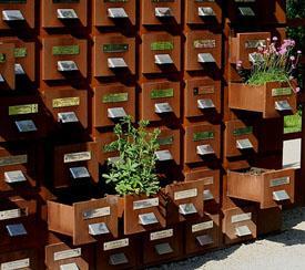 Wooden card catalog with flowers in it