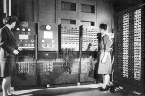 Old photograph of two women operating a large switchboard