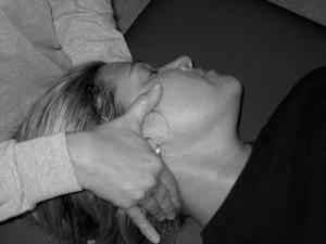 Photo of woman receiving a spine adjustment
