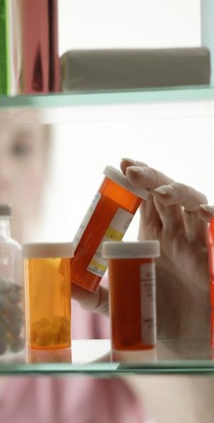 prescription bottles being held by employee